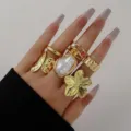Juego de anillos bohemios vintage dorados con flores y perlas para mujer - Juego de Anillos de Oro con Perlas Artificiales (6425601)
