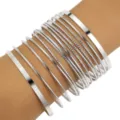 Set of silver stacked bangles featuring mixed smooth and textured metal finishes - Mixed Texture Multi-circle Set (5982602) / Silver