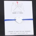 Blaues Kordel Herz Anhänger Armband, stilvolles gewebtes verstellbares Paar Wunsch Armband. - Silber- und blaues Seil