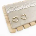 Detailed view of gold heart-shaped huggie earrings with shimmering pavé accents. - Heart Rhinestone Style (4) / Gold