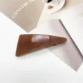 Macro detail showing the smooth texture of a minimalist brown resin geometric hair clip - Amber Brown Marble (17)