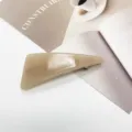 Detailed close-up showing the smooth marble texture of a minimalist beige resin hair clip - French Minimalist Beige (15)
