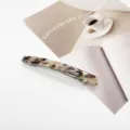 Close-up of elegant tortoiseshell resin hair clip with silver spring mechanism - Rectangular Spring Clip (1) / Tortoise