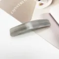 Close-up detail of an elegant grey marbled acetate rectangular spring hair clip for women - Grey Marble Pattern (2)