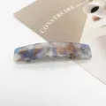 Detail view of blue and brown marble pattern acetate rectangular spring hair clip - Tortoiseshell Texture (1)