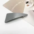Detail view of a minimalist grey geometric resin hair clip with durable spring mechanism - Matte Low Saturation Gray (4)