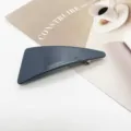 Close-up of a minimalist geometric dark blue resin hair clip on a styled background. - Dark Blue Glossy Geometric (5)