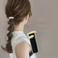 Side view showing a metallic spiral hair tie creating a stylish bubble braid ponytail - Style B Silver