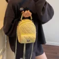 Fashionable yellow mini quilted backpack for women featuring a chain strap and crystals - Yellow