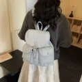 Light blue canvas backpack with silver star pattern and drawstring flap for women - Blue