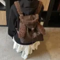 Mochila linda de cuero sintético marrón con orejas de conejo de felpa para el invierno - Café