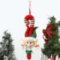 Detailed close-up of the cute Christmas elf hanging plush doll with red and green colors. - Cane Elf Girl
