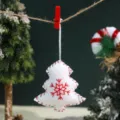 Christmas tree plush ornament detail, white felt hanging decoration with red stitched edges. - White Christmas Tree Pendant