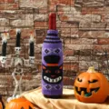 Halloween knitted wine bottle cover featuring spooky cat design for holiday table decor - Black Cat