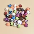 Close-up view of mixed color 10-13mm acrylic skull beads for DIY jewelry accessories - Random Mixed Colors