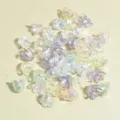 Close-up detail of 11mm iridescent mixed AB color lily-shaped acrylic flower beads - Translucent AB Mix (NO.9)