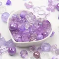 Close-up detail of mixed purple acrylic beads in various shapes for DIY jewelry making - 500g Pack / Purple
