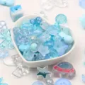 Detail shot of blue acrylic beads in various shapes and sizes for DIY jewelry making - 500g Pack / Blue