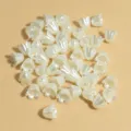Close-up of 11mm pearl-colored flower-shaped acrylic beads for DIY jewelry - Pearl White (NO.1)