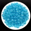 Macro view of blue 8mm crackle acrylic beads for DIY jewelry making and bracelets - Blue