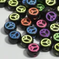 Close-up of 7mm black acrylic beads featuring colorful neon peace sign patterns. - 3800 Pieces/Pack (4x7mm) / Black with Colorful