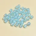 Macro shot of 8mm light blue AB iridescent acrylic beads for DIY jewelry making projects - 8mm / Light Blue