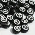 Close-up of black 7mm acrylic beads with white peace symbol for DIY jewelry making. - 3800 Pieces/Pack (4x7mm) / Black with White