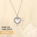 Macro detail of a vintage-style stainless steel heart pendant necklace with shell - Heart Mother of Pearl (HPNK023) / Steel
