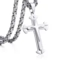 Close-up detail of a multi-layered silver stainless steel cross pendant with chain. - Split Silver Style With Byzantine Chain