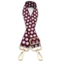 Dettaglio tracolla regolabile bordeaux a pois con accessori metallici dorati - Borgogna