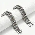 Close-up macro detail of heavy stainless steel Cuban link bracelet with square clasp design - 5mm Width Square Jewelry Clasp Style / 18cm Bracelet
