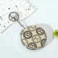 Macro view of portable mini folding mirror keychain with elegant B pattern - Style 1 (Beige Monogram B)