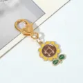 Macro view of detailed sunflower pendant on gold-plated heart clasp - Large Round Sunflower