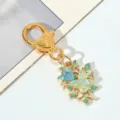 Exquisite flower and butterfly keychain with gold-plated heart-shaped lobster clasp detail - Blue Branch Butterfly Flower