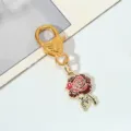 Detailed view of red rose enamel flower pendant with a golden heart lobster clasp - Rose
