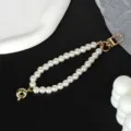Detailed view of the elegant pearl chain strap with a high-quality gold-plated clasp. - Letter Q(Q)