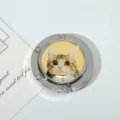 Detailed close-up of a portable folding metal bag hook featuring a cute cat pattern design - Yellow Cat Style