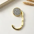 Detail showing a golden foldable table bag hook with sparkling crystal inlay - Double Layer Silver White Rhinestone (镶钻挂包钩) / Silver Style (镶钻挂包钩)