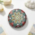 Detailed view of a vintage ethnic style round portable makeup mirror with mandala pattern - Ochre Dark Gray