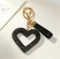 Detailed view of luxury black rhinestone hollow heart keychain with elegant gold clasp - Hollow Heart Rhinestone Keychain / Classic Black