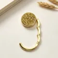High-definition macro view of golden folding purse hook with textured sparkling inlay - Double Layer Champagne Gold Rhinestone (镶钻挂包钩) / Champagne Gold Style (镶钻挂包钩)