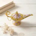Detail view of a purple and gold Aladdin lamp ornament on a white wooden surface. - Large (14cm) / Purple