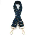 Close-up detail of leopard print bag strap with metallic gold thread and gold metal clips - Gold Thread Black Blue Leopard (No. 7) / Silver Buckle