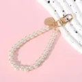 Detail van elegante parelketting met gouden sluiting voor tassen en doe-het-zelf - Crèmewit Goud Munt Stijl (Stijl 1)