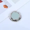 Close-up of portable metal purse hook with light blue pebbled leather insert for desk - Blue