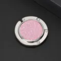 Detail view of portable circular folding bag hook with shimmering pink glitter inlay - Purple (Glitter)