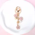 Detailed macro view of pink cherry blossom keychain with elegant pearl accents - Plum Blossom / Pink