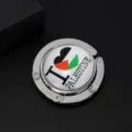 Close-up of a foldable metal handbag hook featuring an I Love Palestine flag design - Palestine Heart Style
