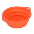 Portable collapsible silicone pet bowl with dual handles and hanging holes for outdoor feeding. - Orange