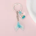 Detail of mermaid tail keychain with blue glitter finish and seashell bottle pendant - Blue White Gradient Shell Bottle (Style 07)